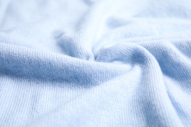 Photo of Warm cashmere sweater as background, closeup view