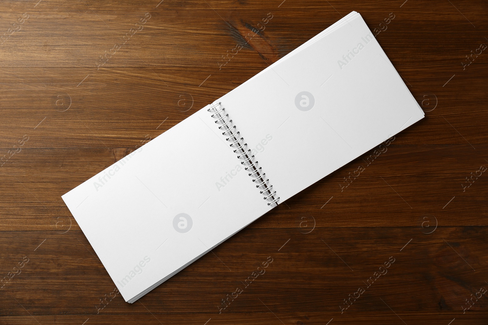 Photo of Blank paper brochure on wooden table, top view. Mockup for design