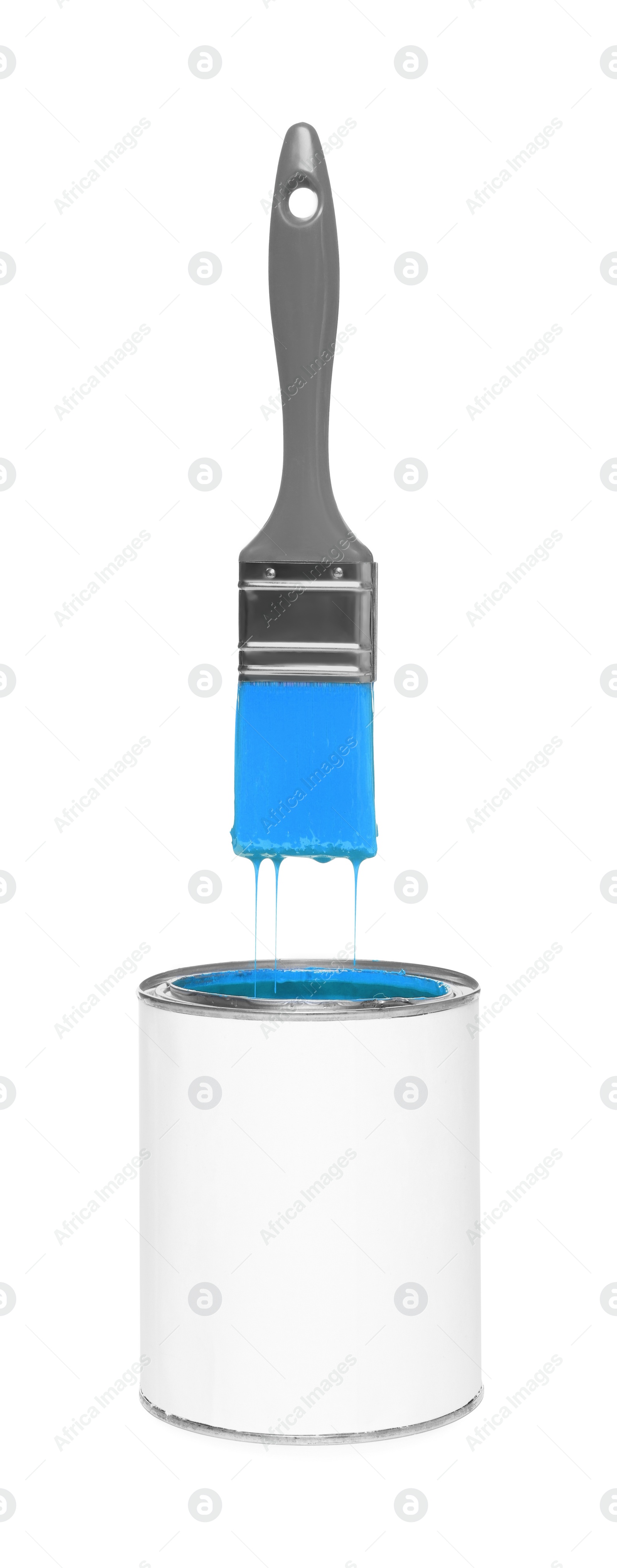 Image of Brush with light blue paint in air over can on white background