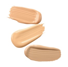 Photo of Samples of liquid skin foundations on white background, top view
