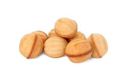 Photo of Delicious nut shaped cookies with boiled condensed milk on white background