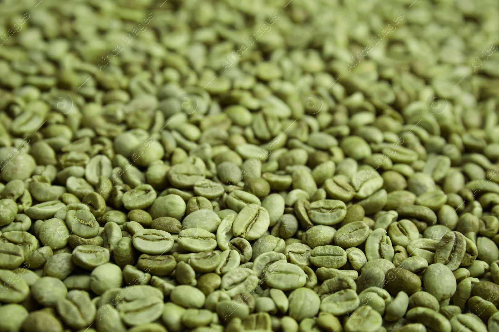 Photo of Pile of green coffee beans as background, closeup