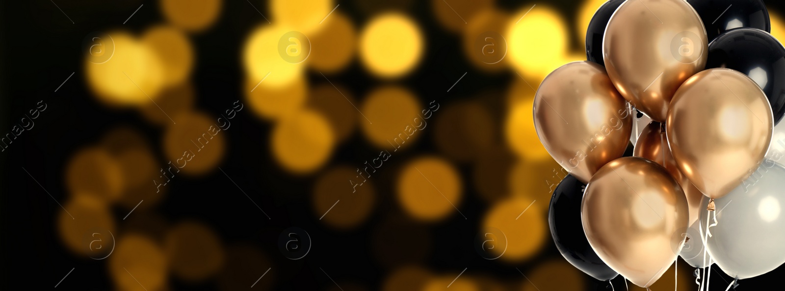 Image of Bright balloons on color background with bokeh effect, space for text. Banner design