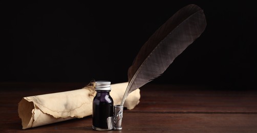 Quill, bottle of ink and parchment scroll on wooden table. Banner design