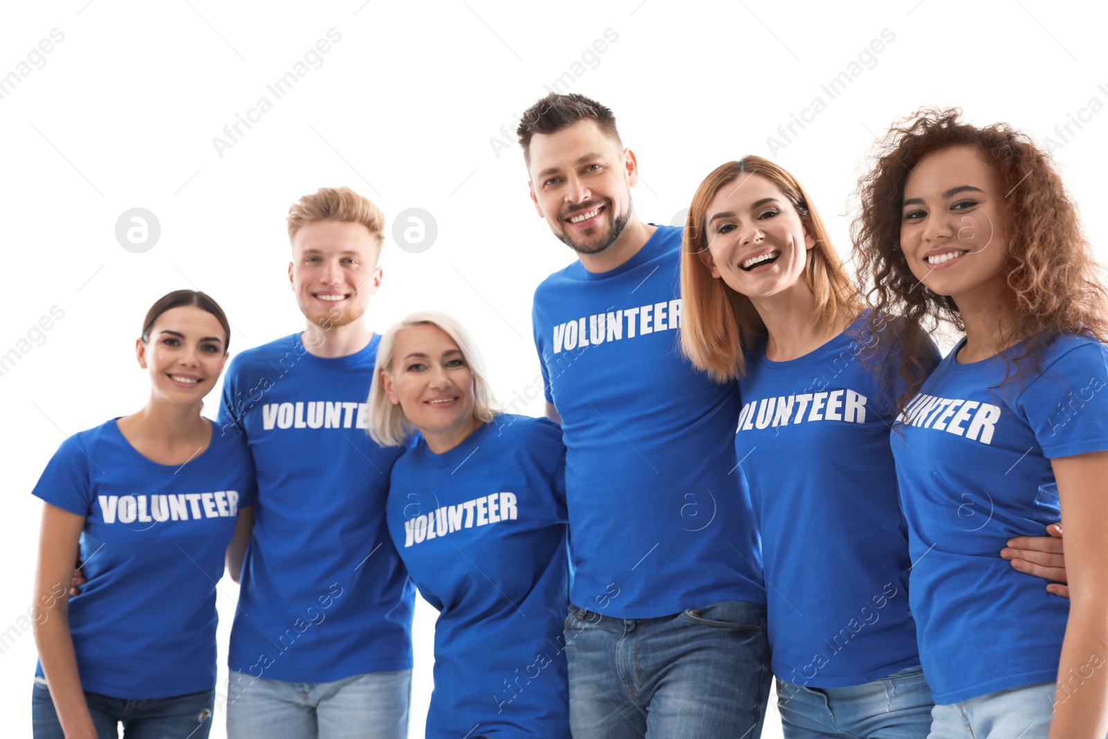 Photo of Team of volunteers in uniform on light background