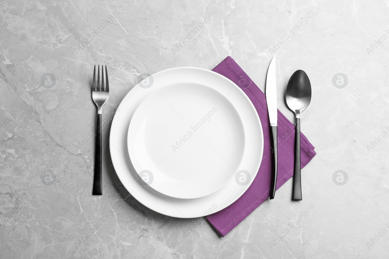 Photo of Elegant table setting on grey marble background, flat lay