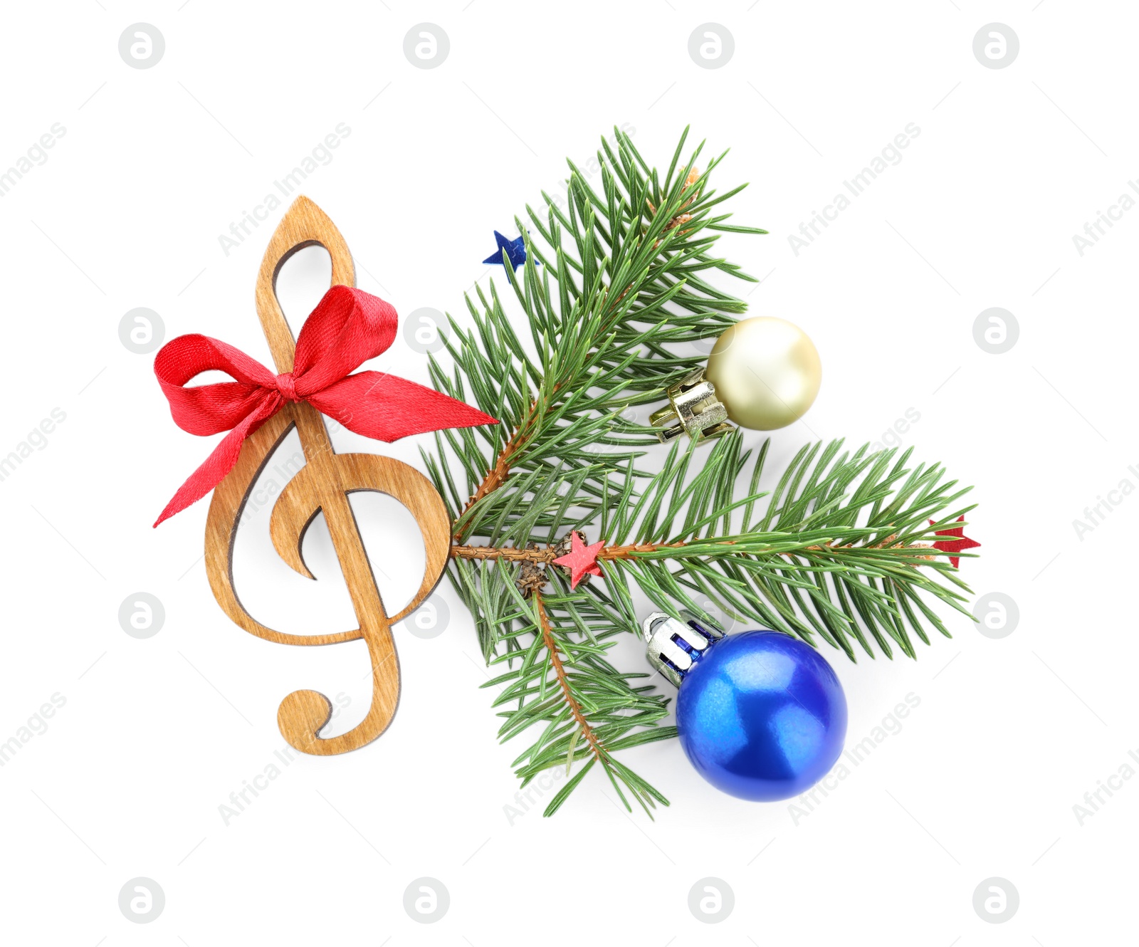 Photo of Fir tree branch with wooden music note and Christmas ball on white background, top view