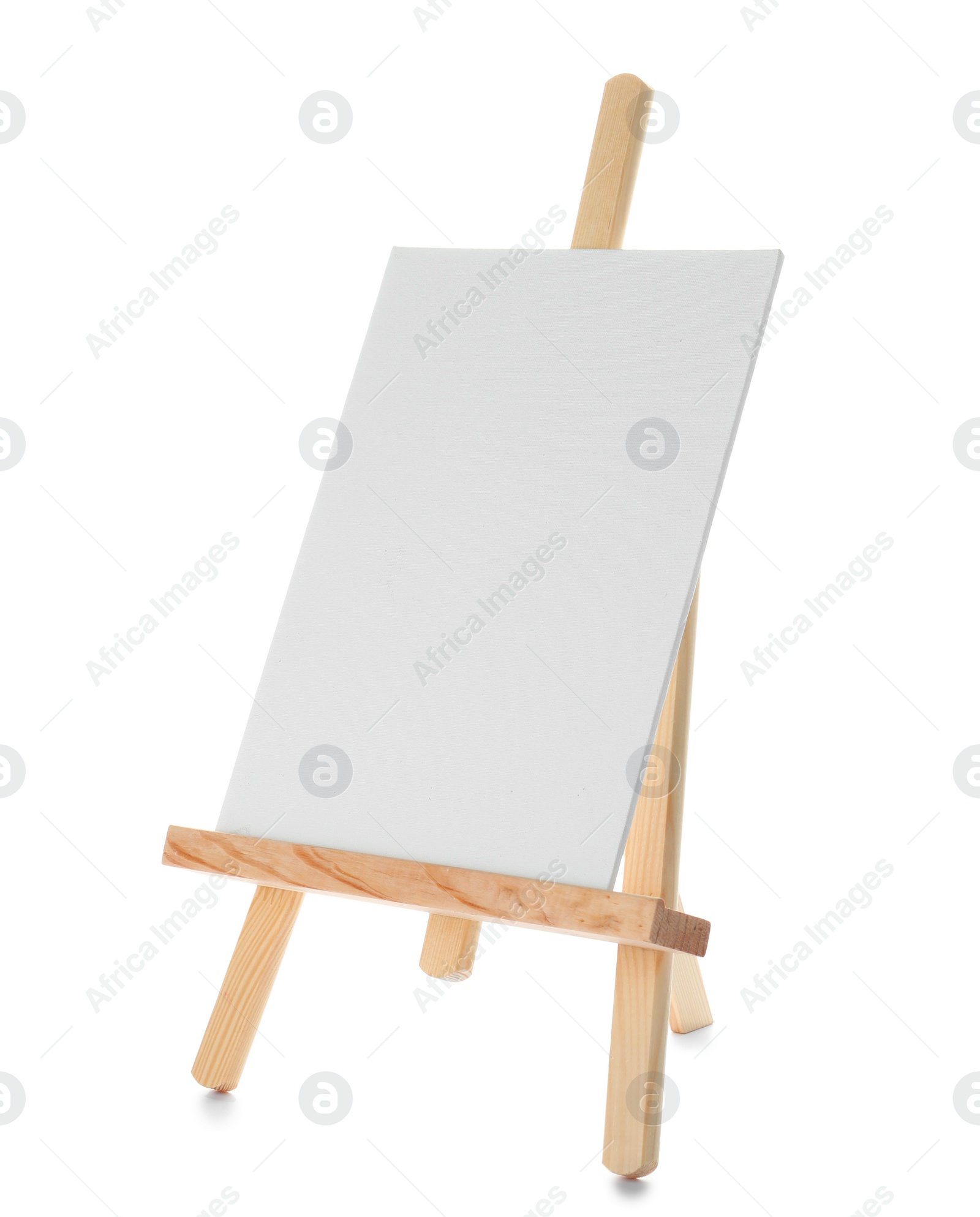 Photo of Wooden easel with blank canvas board on white background. Children's painting