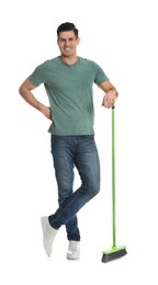 Photo of Man with green broom on white background