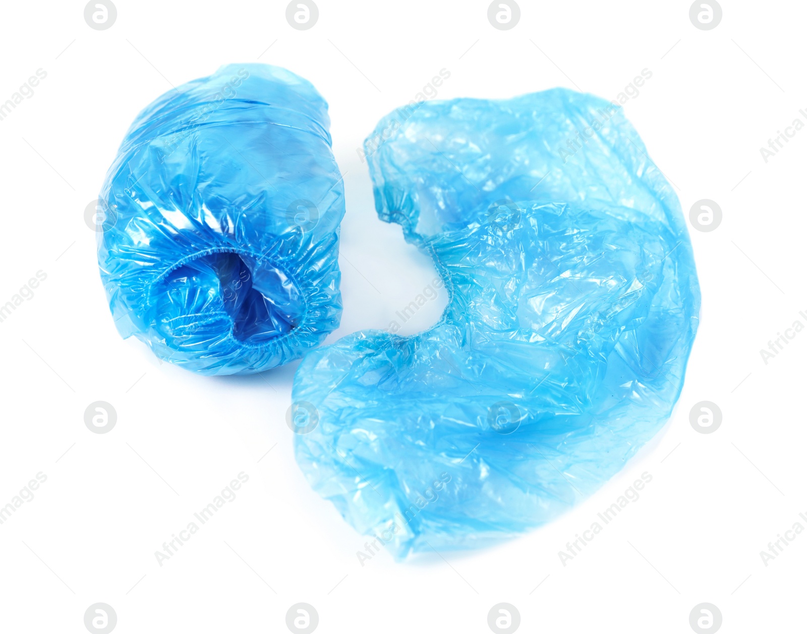 Photo of Medical blue shoe covers on white background