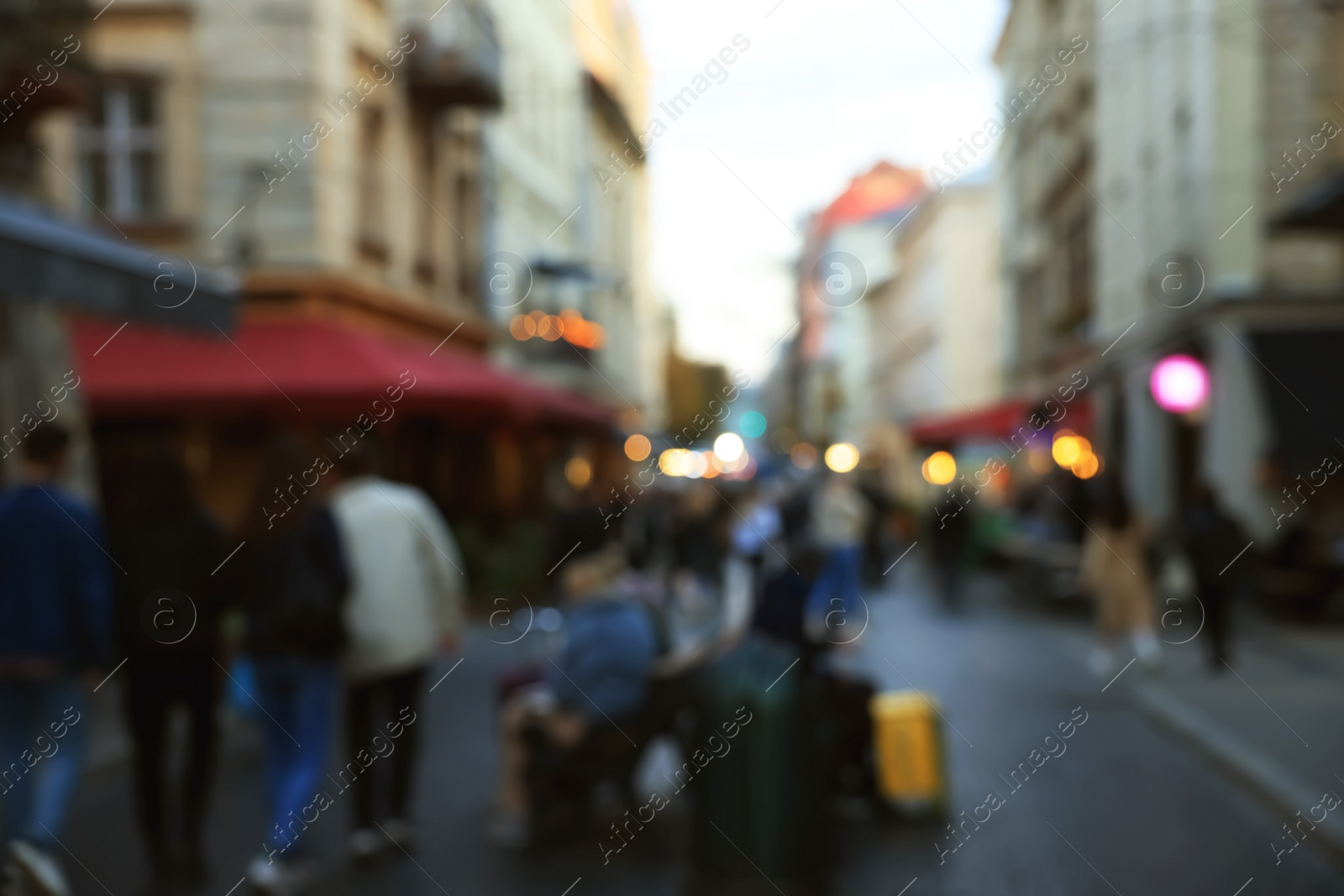 Photo of Blurred view of people walking on city street