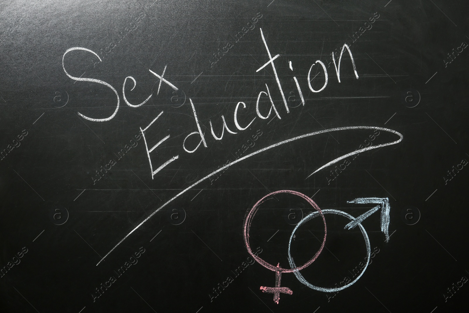 Photo of Gender symbols and phrase "SEX EDUCATION" written on black chalkboard