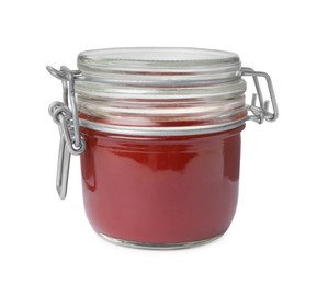 Photo of Tasty ketchup in glass jar isolated on white