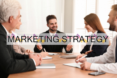 Image of Digital marketing strategy. Team of professionals working together at table in office
