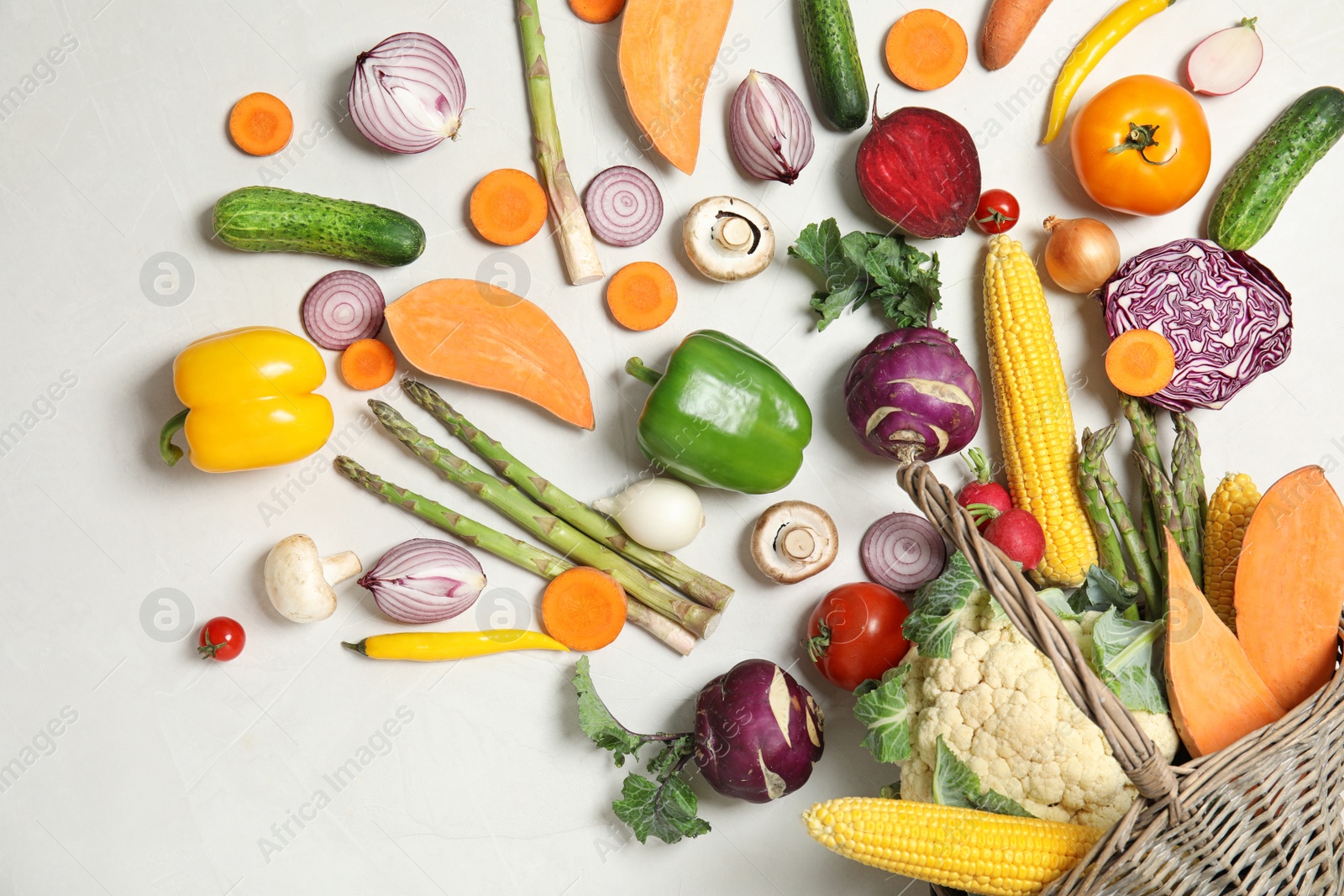 Photo of Flat lay composition with fresh vegetables on light background