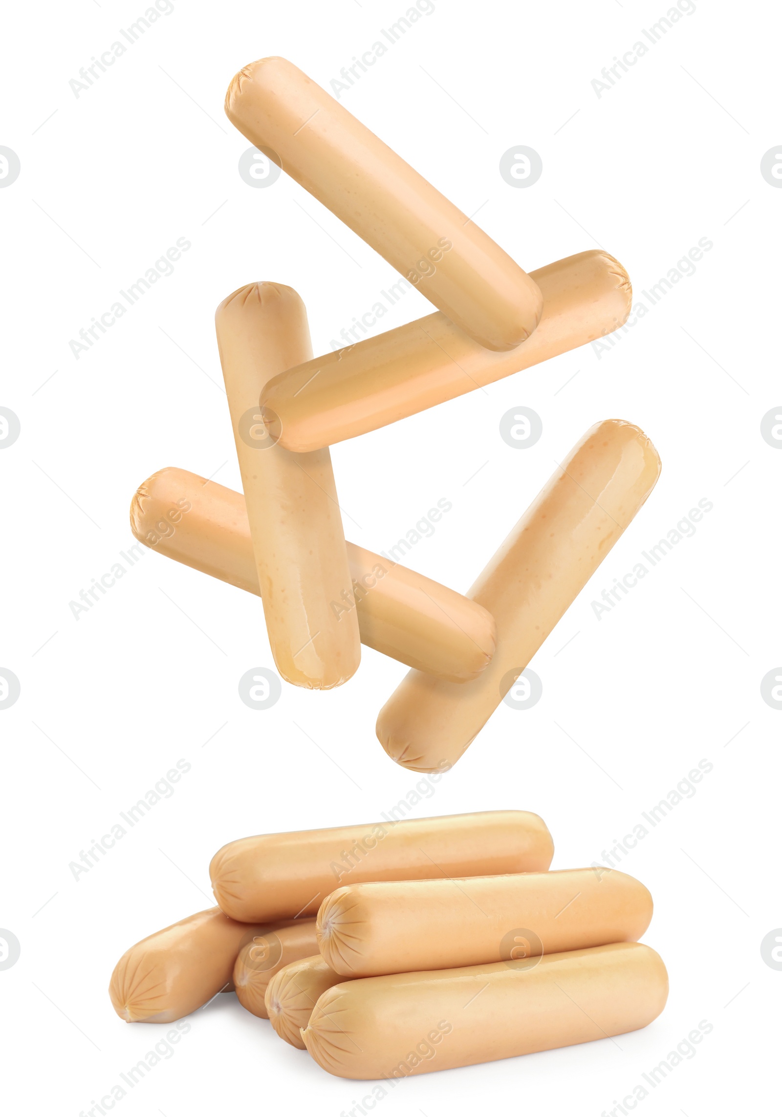 Image of Fresh raw sausages falling on white background