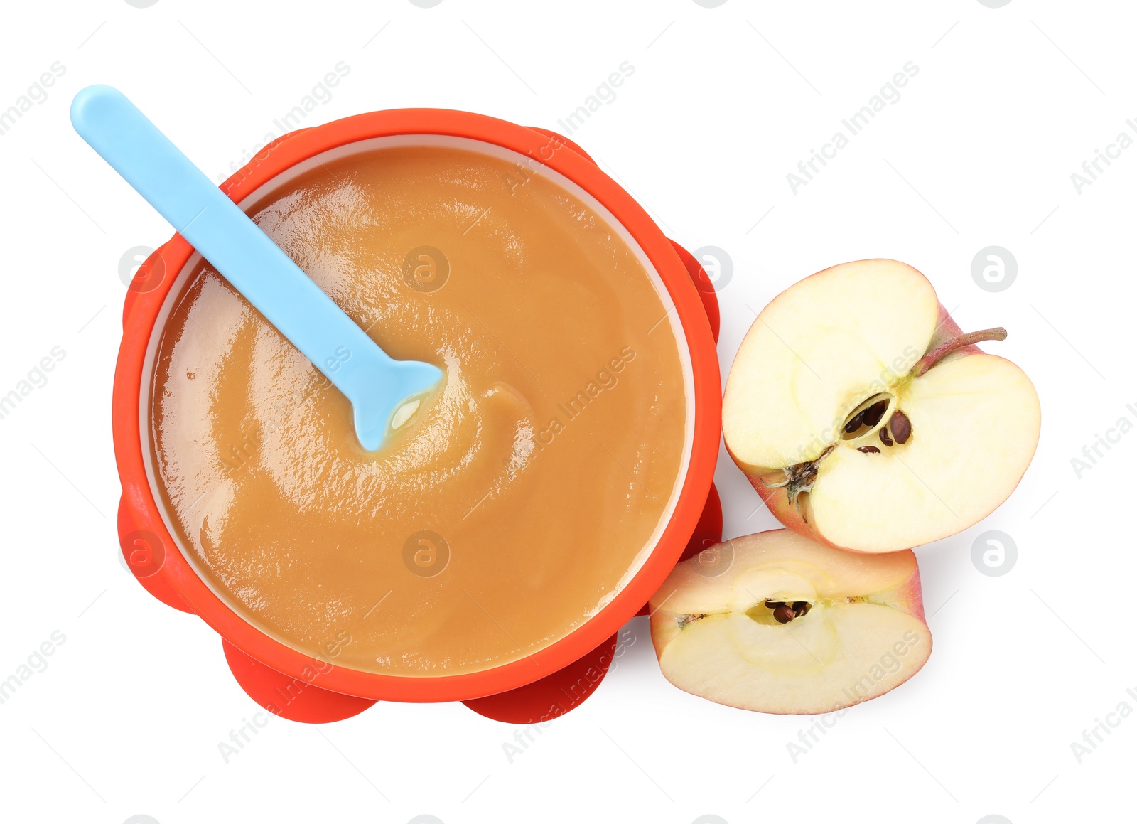Photo of Tasty baby food in bowl, spoon and cut apple isolated on white, top view