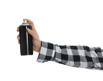 Man holding black can of spray paint on white background, closeup