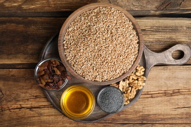 Photo of Ingredients for traditional kutia on wooden table, top view