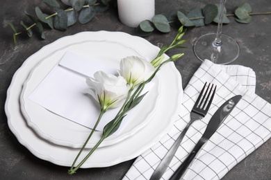 Elegant festive table setting on dark grey background