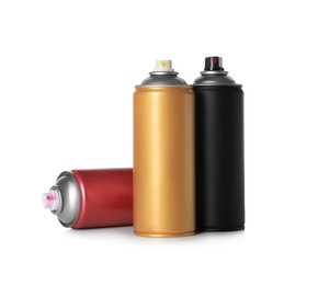 Photo of Cans of different spray paints on white background. Graffiti supplies