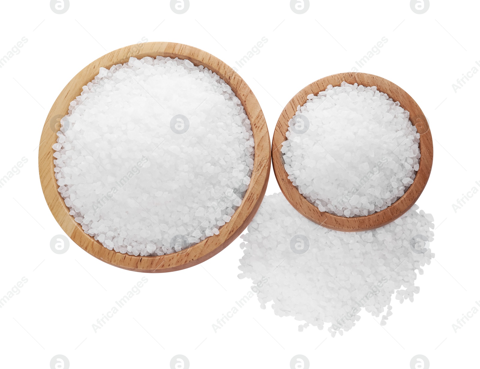 Photo of Wooden bowls and heap of natural sea salt isolated on white, top view