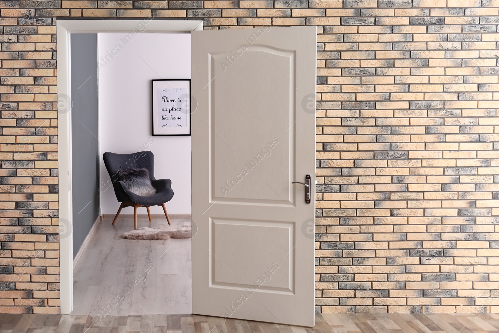 Photo of Stylish room interior, view through open door