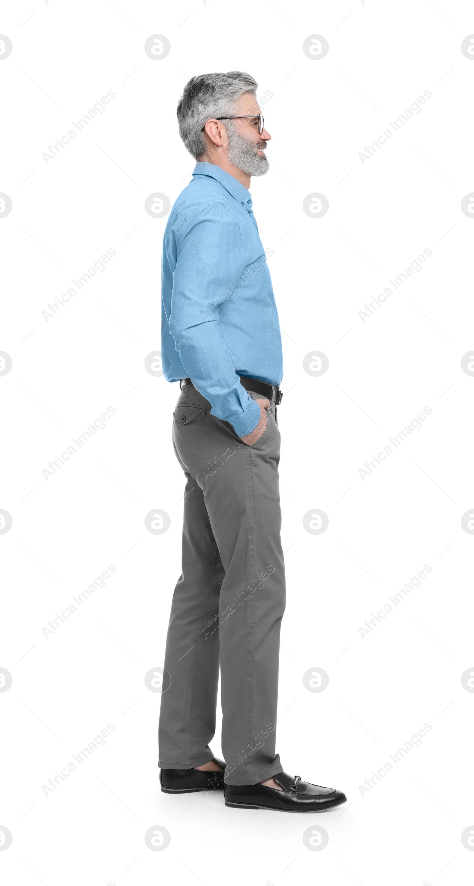 Photo of Mature businessman in stylish clothes posing on white background