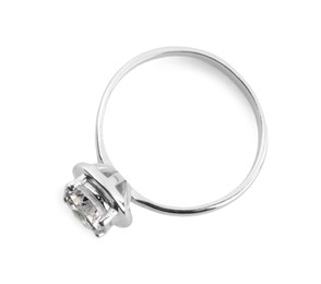 Photo of Beautiful engagement ring with gemstone isolated on white, top view