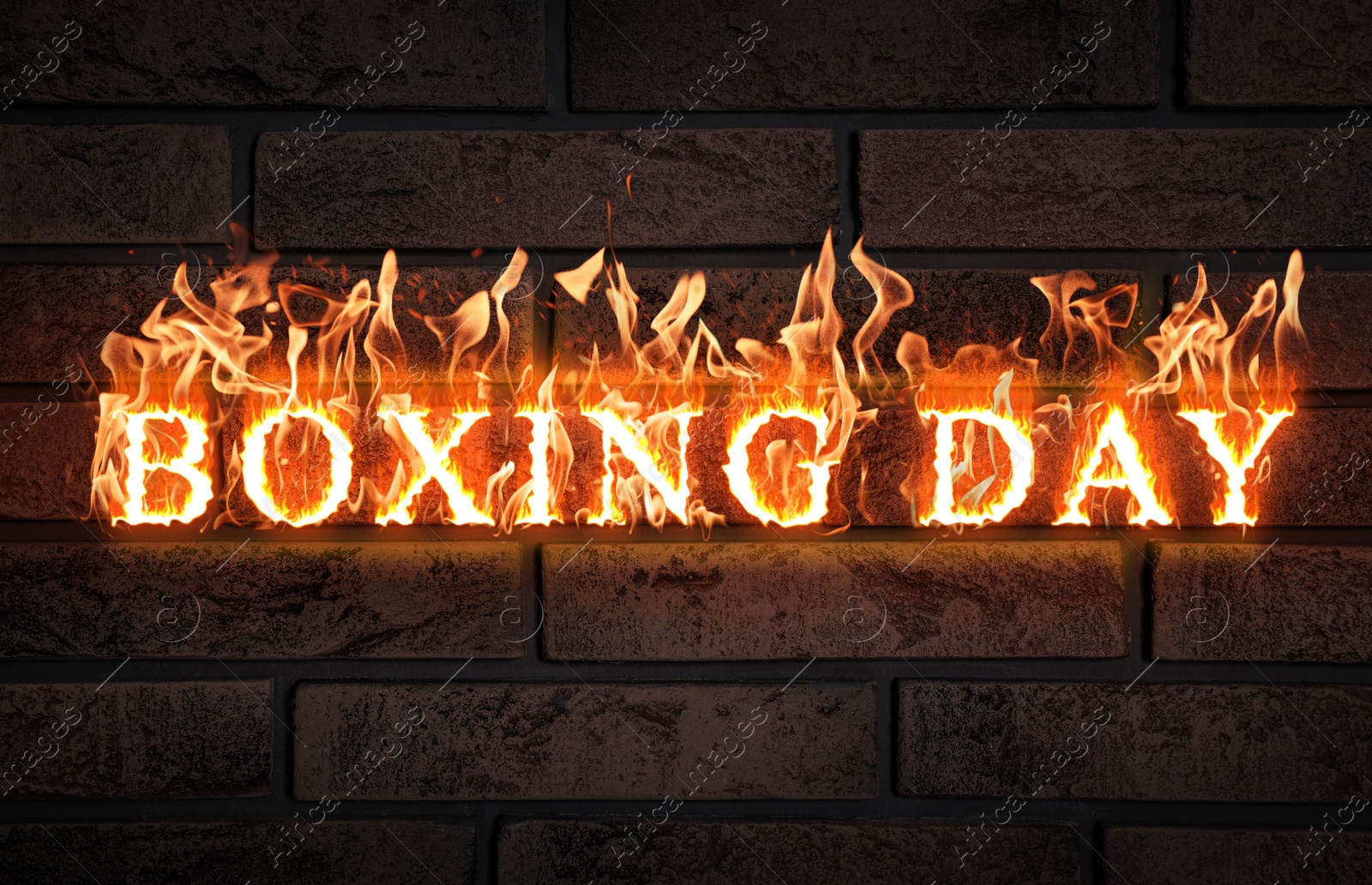 Image of Flaming text Boxing Day against brick wall