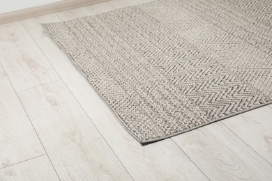 Soft grey carpet on white laminated floor indoors, space for text