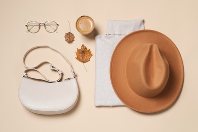 Flat lay composition with stylish hat on beige background