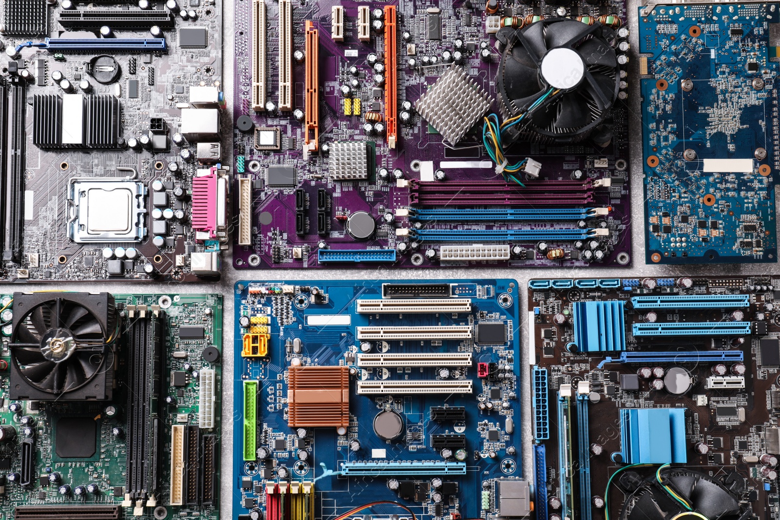 Photo of Computer motherboards on table, flat lay. Electronic device