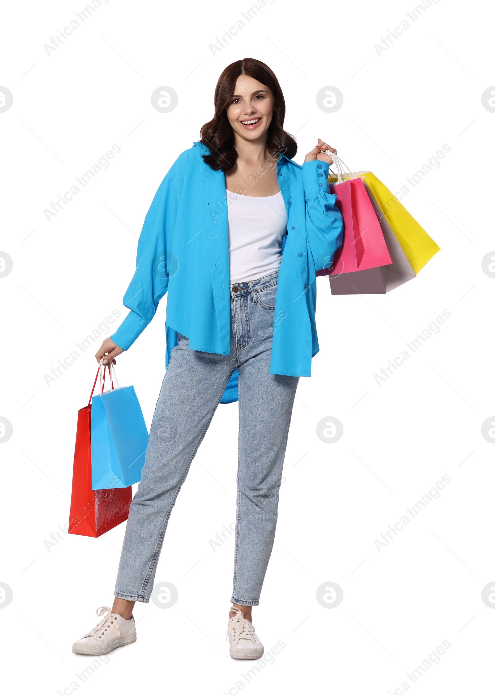 Photo of Beautiful young woman with paper shopping bags on white background