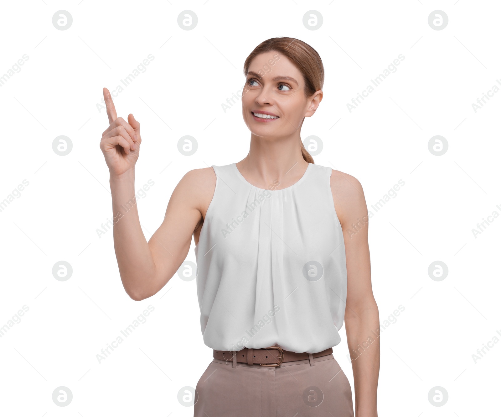 Photo of Beautiful happy businesswoman pointing at something on white background