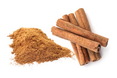 Image of Aromatic cinnamon sticks and powder on white background