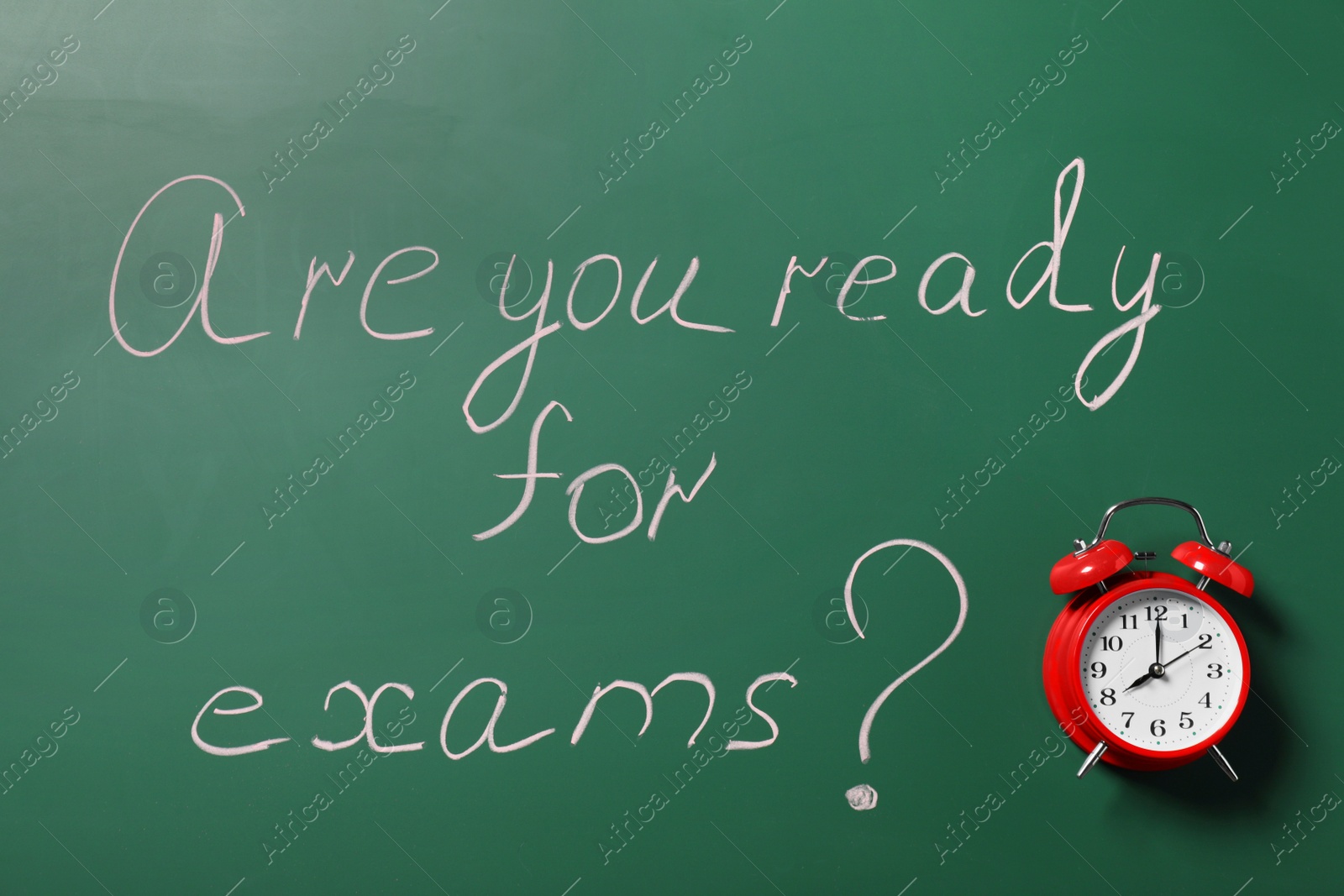Photo of Green chalkboard with phrase Are You Ready For Exams and alarm clock as background, top view