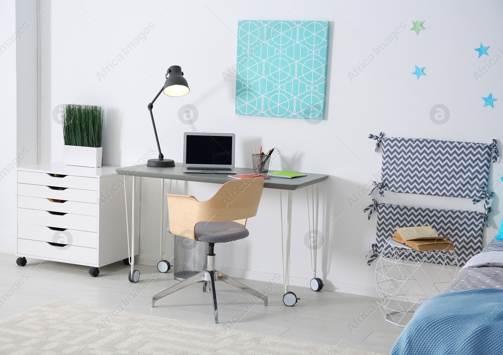 Photo of Modern child room interior with comfortable bed and desk