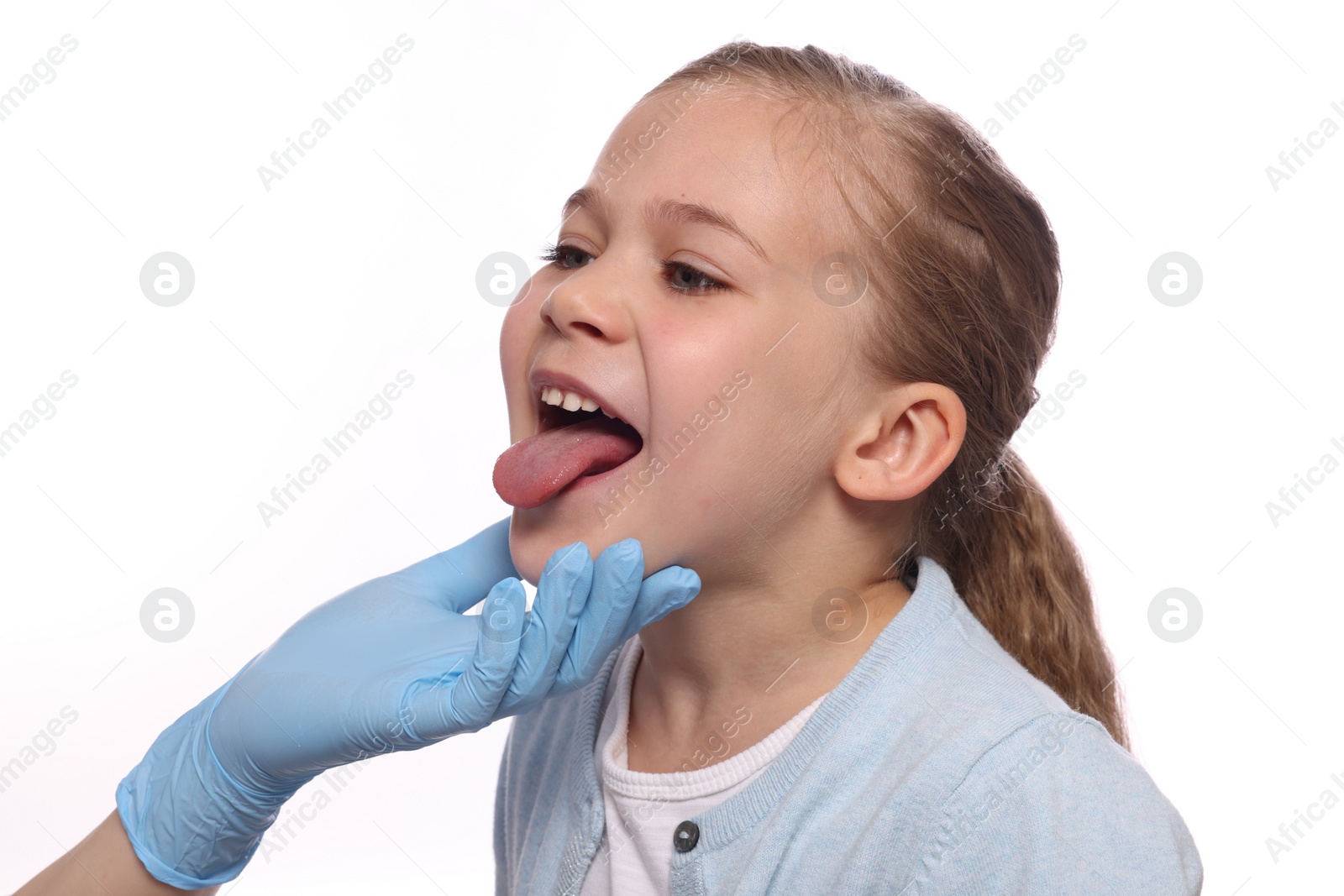 Photo of Doctor examining girl`s oral cavity on white background