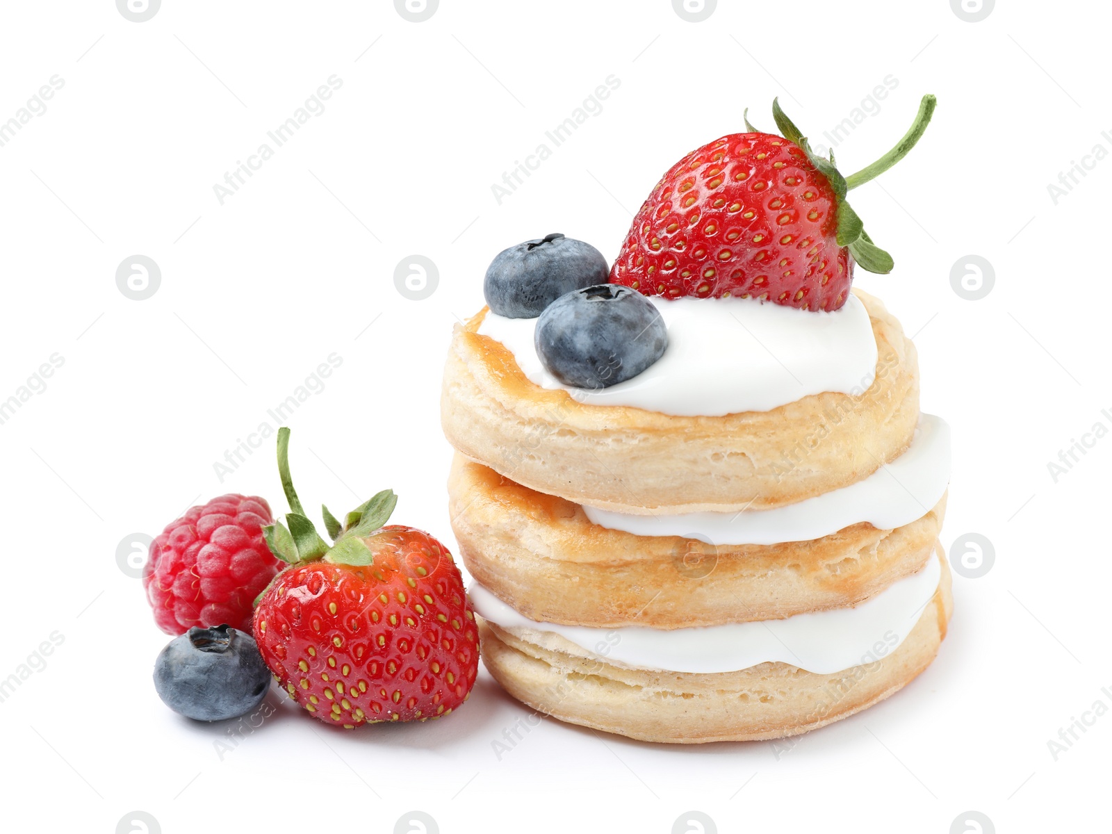 Photo of Fresh delicious puff pastry with sweet berries on white background