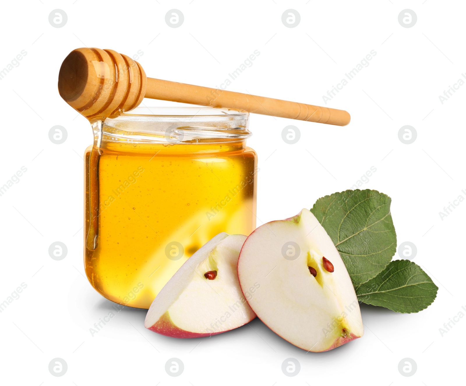 Image of Honey in glass jar, cut apple and dipper isolated on white