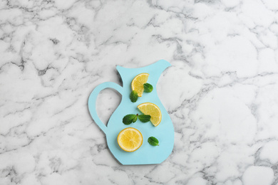 Photo of Creative lemonade layout with lemon slices and mint on white marble table, top view