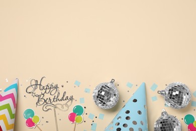 Flat lay composition with disco balls and party decor on beige background, space for text