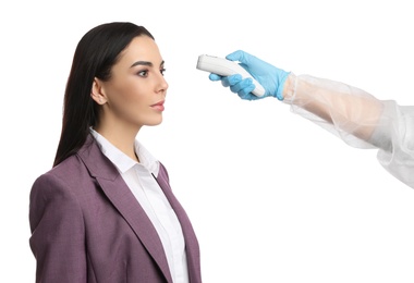 Doctor measuring woman's temperature on white background, closeup. Prevent spreading of Covid-19