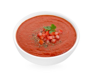 Photo of Delicious tomato cream soup with spices in bowl isolated on white