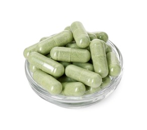 Vitamin capsules in bowl isolated on white. Health supplement