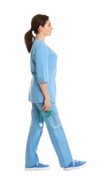 Full length portrait of female doctor in scrubs isolated on white. Medical staff