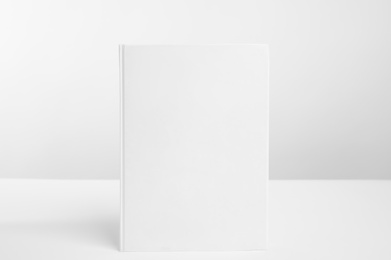 Photo of Book with blank cover on white background