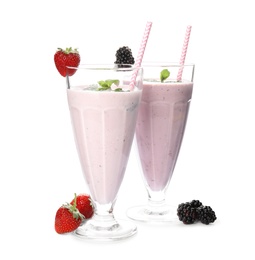 Photo of Tasty fresh milk shakes and ingredients on white background