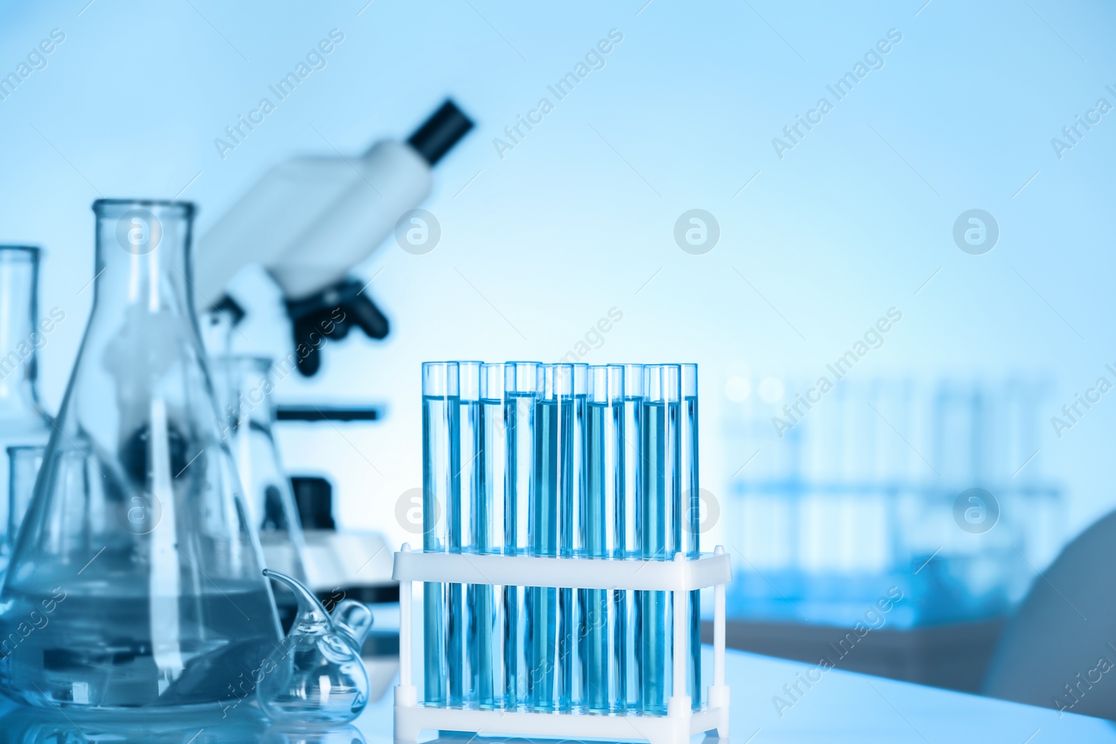 Photo of Laboratory glassware on table indoors. Chemical analysis